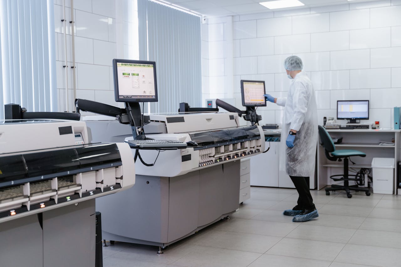 The Art of Drawing Readers In: Your attractive post title goes here Scientist in a lab gown interacting with equipment in a modern laboratory setting.